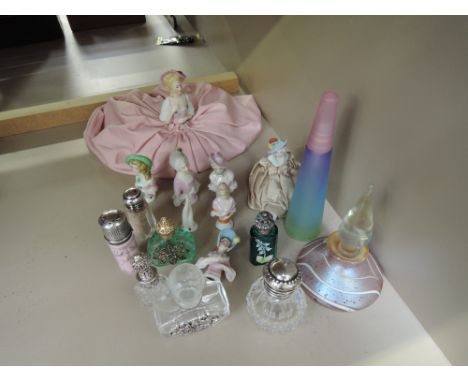 A selection of ceramic pin head dolls and a selection of modern glass perfume bottles
