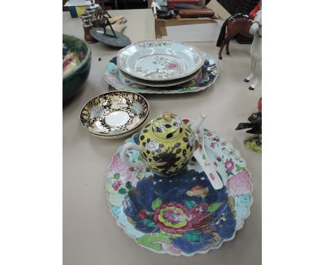 A 19th century stoneware platter of Chinese design, a similar plate, a pair of early 19th century Chinese dishes having polyc