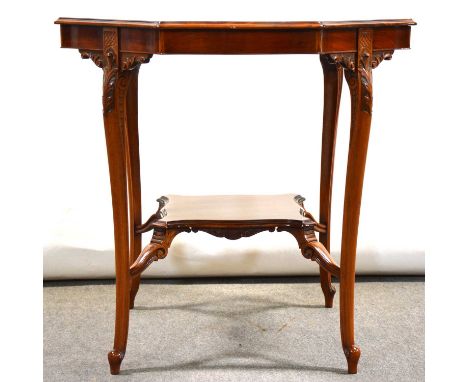 Late Victorian walnut window table, octagonal top with serpentine edge, carved cabriole legs joined by a shelf, the top 75cm,