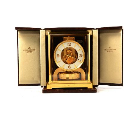 A Jaeger leCoultre Atmos clock,brass and glazed case, circular white dial, 22cm, with case, clock is running at present time 