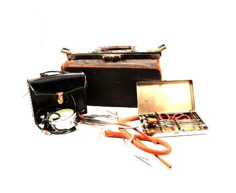 Vintage leather Gladstone doctor's bag and other vintage medical equipment.Qty: 3