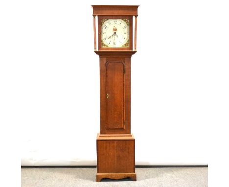 Oak and mahogany longcase clock, cavetto cornice, turned columns, trunk with long door, bracket feet, twelve inch square pain