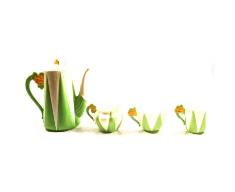 A Shelley  'Apple Green Star' part tea and coffee service, in the Dainty shape,  the coffee pot, jugs and cups with yellow fl