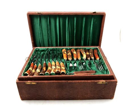 A K Kimmel, Solingen Germany, canteen of cutlery, eight place settings, horn-handles engraved with stags, boars, ducks and hu