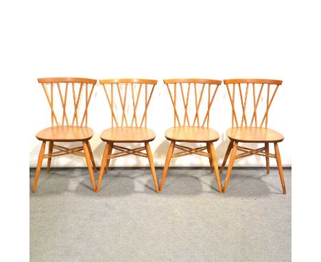 Ercol elm and beech kitchen table, oval top with two drop leaves, splayed legs, 114x125cm, height 72cm, and four chairs with 