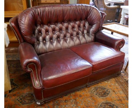 Red leather 2 seater button back sofa