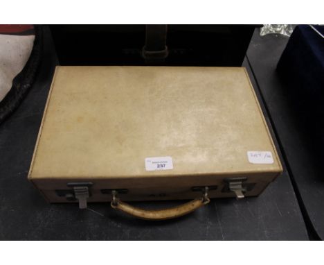 Vellum style suitcase and black trunk