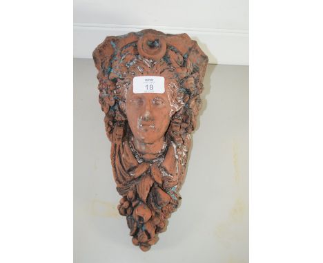 TERRACOTTA WALL BRACKET MODELLED AS THE HEAD OF A CLASSICAL LADY