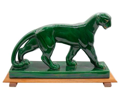 St Clement - A French Art Deco ceramic Panther figurine, in a green glaze, marked to side and no. 4185. On a detachable woode