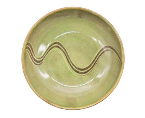 Sidney Tustin for Winchcombe Pottery - A Studio Pottery green glazed bowl with brown swirl design to centre, with Winchcombe 