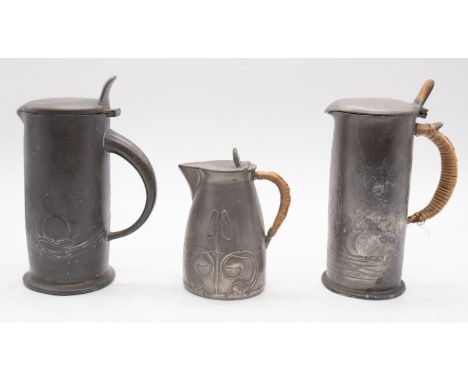 Liberty & Co 'English Pewter' - A small collection of early 20th Century pieces to include; a tall hot water pot, pewter hand