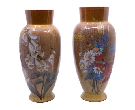 Linthorpe Pottery - Two similar early 20th century stylish vases, both with later hand painted floral designs. Impressed fact