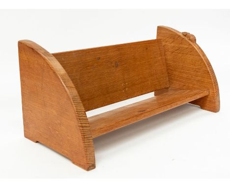 Workshop of Robert 'Mouseman' Thompson - An oak book trough, with quarter curved sides, plank back and bottom, with signature