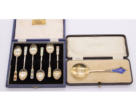 A cased set of six mid 20th century silver tea spoons with enamelled feather like patterned terminals, hallmarked Birmingham,