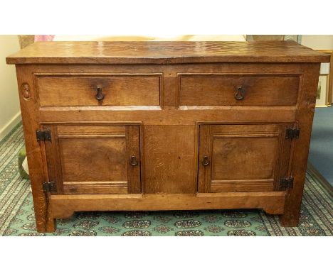 Robert 'Mouseman' Thompson - An early to mid 20th Century stylish adzed oak sideboard, with two drawers and two doors opening