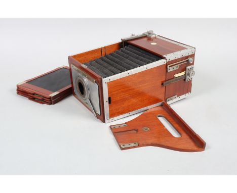 A Shew 'The Xit' Half-Plate Mahogany and Aluminium Folding Camera Body, circa 1910, chamfered-corner black bellows, mahogany 