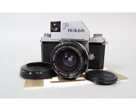 A Nikon F Photomic Camera, chrome, serial no 6592704, shutter working, self timer working, with model I photomic finder, mete