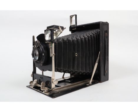 An Ernemann Heag Half-Plate Folding Camera, circa 1920, double extension, body G, Ibsor shutter sticking at slowest speeds, G