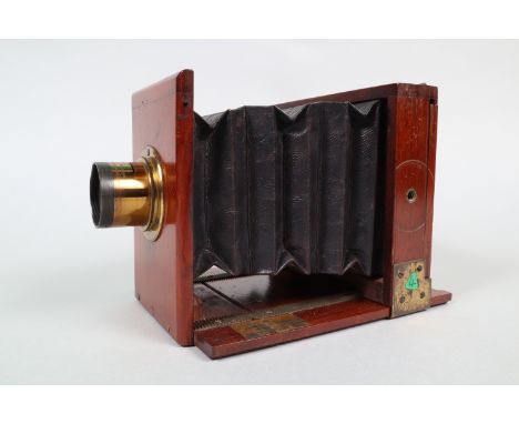 A Quarter-Plate Tailboard Camera, circa 1885, no maker's plate, a Ross London 5 x 4 Rapid Symmetrical brass lens, serial no 2