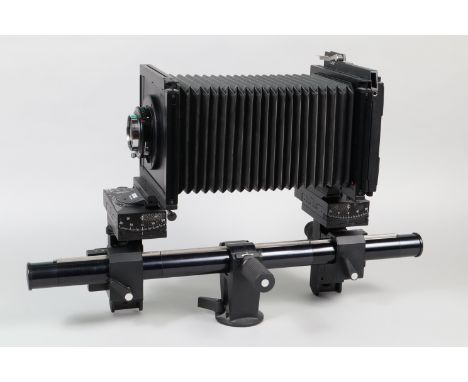 A Sinar P2 Camera, serial no on tripod mount 47540, with rise, fall, pan and tilt movements, all moves freely, body G-VG, sli