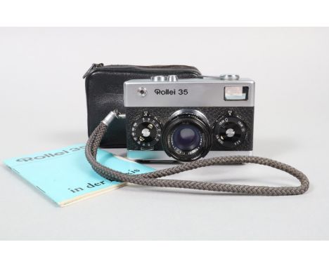 A Rollei 35 Compact Camera, made in Germany, serial no 3166551, shutter working, meter responsive, body G-VG, with Carl Zeiss