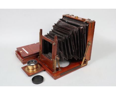 A Pearson &amp; Denham Whole Plate Mahogany Field Camera, circa 1890, body F, square-cornered maroon bellows P-F, holes to co