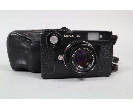 A Leica CL 35mm Camera, serial no 1406085, shutter working, meter responsive, body G, some brassing to side of top plate, som