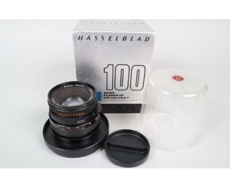 A Hasselblad Carl Zeiss T* 100mm f/3.5 Planar CF Lens, serial no 6565182, shutter working, barrel G, paint wear to filter rin