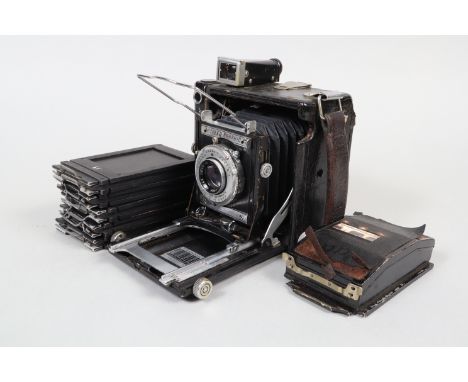 A Graflex Miniature Speed Graphic Press Camera, circa 1946, format 2¼ x 3¼in, body F, Kodak Ektar 101mm f/4.5 lens F, haze, S