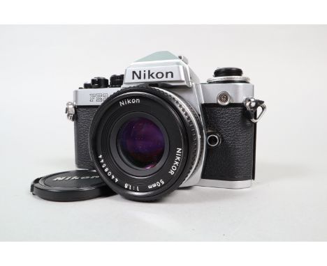 A Nikon FE2 Camera, chrome, serial no 2219672, shutter working, meter responsive, self timer not triggering shutter, body G-V