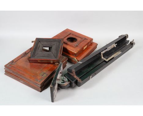 A Gandolfi Tripod and Other Accessories, a wooden tripod, painted black, stamped L. Gandolfi on the central column, 2 section