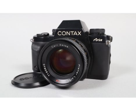 A Contax Aria Camera,  serial no 007753, powers up, shutter working, appears to function as should, bod G, some wear, light s