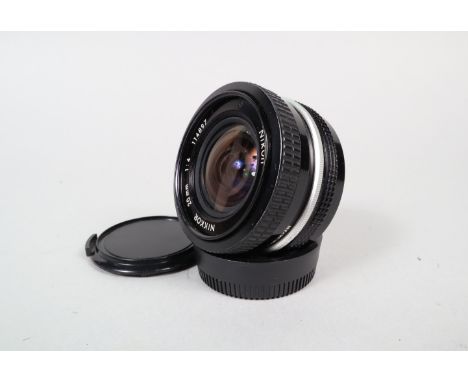 A Nikon Nikkor 20mm f/4 AI Lens, serial no 114897, barrel G, light wear, elements VG, with Nikon rear cap and unbranded front