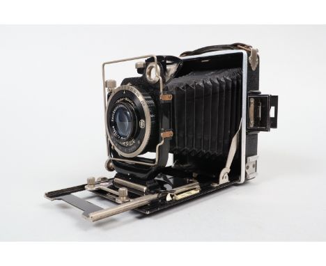 A German 6.5 x 9cm Folding Plate Camera, circa 1930, body G, double extension, Compur rim-set shutter working, Carl Zeiss Jen