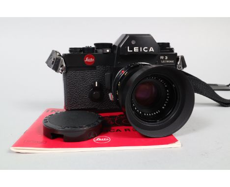 A Leitz Wetzlar Leica R3 Electronic Camera, black, 1976, serial no 1449372, shutter working, meter responsive, body VG, with 
