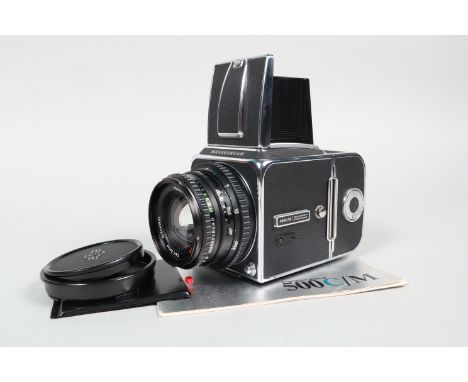 A Hasselblad 500 CM Camera, chrome, serial no UI 157929, shutter working, body VG, with Carl Zeiss T* 80mm f/2.8 Planar lens,