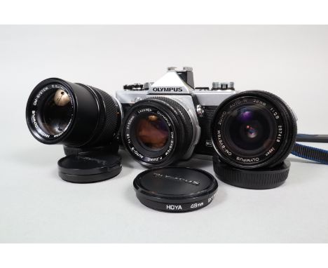 An Olympus OM 1 MD Camera Outfit, serial no 1924619, shutter working, self timer working, meter responsive, body G-VG, some l