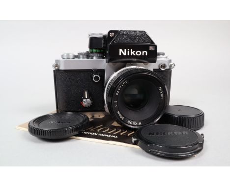 A Nikon F2 Photomic Camera, chrome, serial no 7154687, shutter working, self timer working, with DP-1 finder, meter responsiv