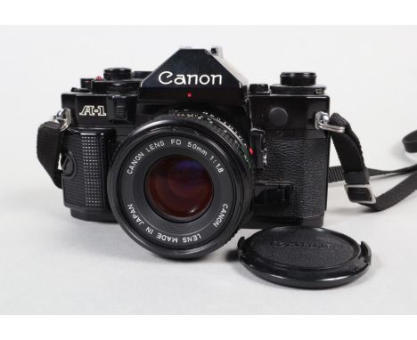 A Canon A-1 SLR Camera, serial no 2307086, body G-VG, slight brassing on baseplate edge, shutter working, meter reacts to lig