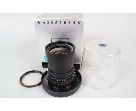 A Hasselblad Carl Zeiss T* 50mm f/4 Distagon C Lens, serial no 6115100, shutter working, barrel G, light marks, elements G, s