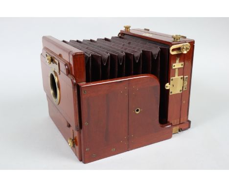 A G. Hare Half-Plate Mahogany Tailboard Camera Body, square-cornered maroon bellows, body G, manufacturer's plate states 'G. 