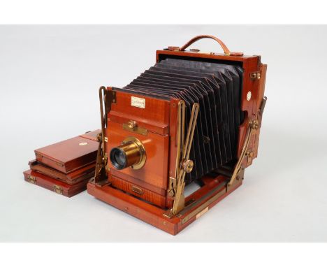 The 'Sanderson' Regular Half-Plate Mahogany Field Camera, serial no 20018, chamfered maroon bellows, body G, this camera has 