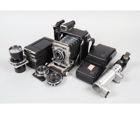 A Graflex Pacemaker Crown Graphic 23 Press Camera Outfit, serial no 714976, 6 x 9cm format, body F, Graflex Optar W.A. 65mm f