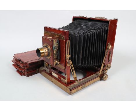 A Thornton Pickard Imperial Triple Extension Half-Plate Mahogany Field Camera, post 1910 model with brass strips above and be