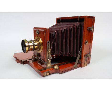 A Lancaster 1888 Patent Instantograph Half-Plate Field Camera, maroon square-cornered tapered bellows, double extension, make