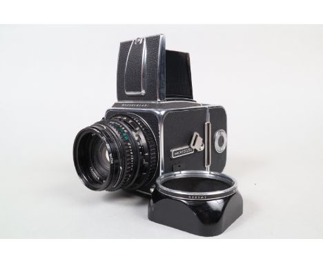 A Hasselblad 500 C/M SLR Camera, serial no UUC 204071,  waist level finder with interchangeable screen, 6 x 6cm film magazine