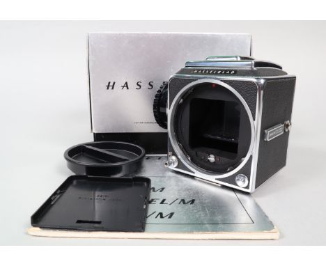 A Hasselblad 500 CM Camera body, chrome, serial no RP 1281312, shutter working, body G, some slight signs of ageing, some scr
