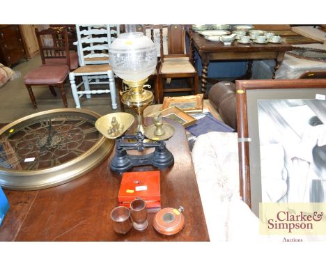 An oil lamp with clear glass shade together with a set of scales; a boxed game set etc