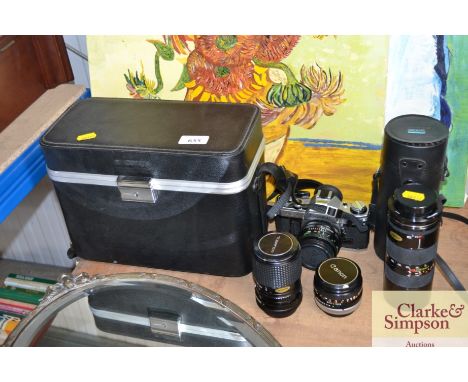 A Canon AEI camera, carrying case and four lenses