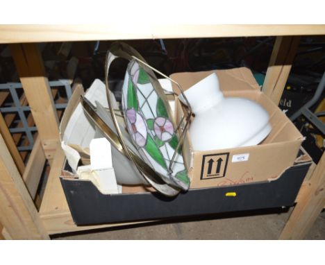A box containing various light shades including Tiffany style for example